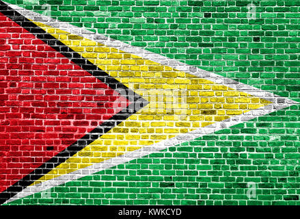 Flag of Guyana painted on brick wall, background texture Stock Photo