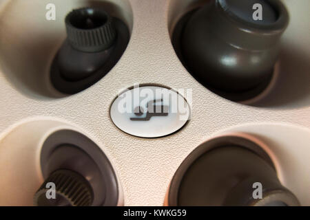 Flight attendant cabin crew call button & cool air nozzles / nozzle array above passenger seat in Embraer aeroplane / airplane / aircraft / air plane Stock Photo