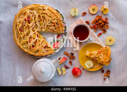 Overhead view of apple pie and drink served on table Stock Photo