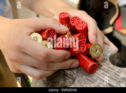 Dewitt, Iowa, USA. 19th June, 2017. A handful of 12 gauge shells in the hands of North Scott Trap Shooting team member Kyle Coomer 18, Monday, June 19, 2017, during practice at the Clinton County Sportsmen Club near DeWitt. Credit: John Schultz/Quad-City Times/ZUMA Wire/Alamy Live News Stock Photo