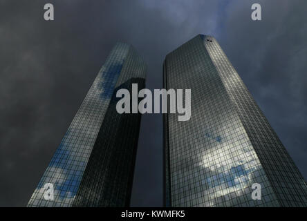 FILE - An archive picture dated 17 December 2011 shows dark clouds gathering over the twin towers of the Deutsche Bank headquarters in Frankfurt Main, Germany. Deutsche BAnk is going to present their annual results for last year on 02 February 2012. Photo: Arne Dedert | usage worldwide Stock Photo