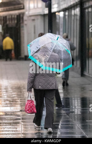 Southport, Merseyside. 4th jan, 2018. UK Weather: Heavy rain pours down on hardy shoppers venturing into Southport town centre looking for bargains in the traditional January sales.  Early morning rain will slowly clear from Cheshire, Merseyside and Manchester, but behind the rain, another swathe of very strong afternoon winds will follow.  Credit: Cernan Elias/Alamy Live News Stock Photo