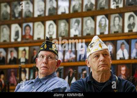 Milan, Iowa, USA. 4th Dec, 2016. Illinois City Post Commander Doug Dungan, left, and Illinois 3rd Division Commander Kevin Kilkenny listen to a speaker at the Milan American Legion on Sunday, December 4, 2016. The Legion holds an annual observance for the attack on Pearl Harbor and for all World War II survivors. Credit: Andy Abeyta/Quad-City Times/ZUMA Wire/Alamy Live News Stock Photo