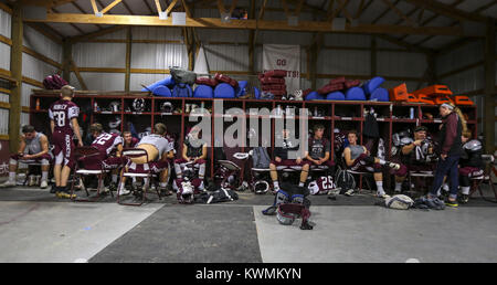 Edgington, Iowa, USA. 20th Oct, 2017. Rockridge varsity players relax and listen to music together in the locker room before their game at Rockridge High School in Edginton on Friday, October 20, 2017. Credit: Andy Abeyta/Quad-City Times/ZUMA Wire/Alamy Live News Stock Photo