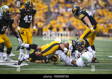 Iowa City, Iowa, USA. 16th Sep, 2017. Iowa Hawkeyes defensive back Amani Hooker (27) tackles North Texas wide receiver Turner Smiley (1) during the fourth quarter of their game at Kinnick Stadium in Iowa City on Saturday, September 16, 2017. Credit: Andy Abeyta, Quad-City Times/Quad-City Times/ZUMA Wire/Alamy Live News Stock Photo