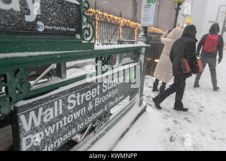 New York, USA. 04th Jan, 2018. Travelers exit the subway in the snow in Lower Manhattan during the first nasty winter storm of the new year on Thursday, January 4, 2018. Mother Nature is predicted to dump 5 to 8 inches of snow in the city and to make matters worse, is adding gusty winds into the mix. The snow will be followed by single digit temperatures guaranteeing that the mounds of the white stuff will never melt. ( © Richard B. Levine) Credit: Richard Levine/Alamy Live News Stock Photo