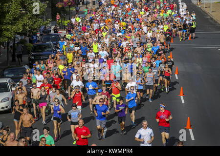 Davenport, Iowa, USA. 13th July, 2017. Runners make their way to the turn from East 4th Street to Pershing Avenue as a part of the altered course due to construction during the Bix at Six training run in Davenport on Thursday, July 13, 2017. The run marks the third and final training run leading up to the Quad-City Times Bix 7 Race on Saturday, July 29. Credit: Andy Abeyta, Quad-City Times/Quad-City Times/ZUMA Wire/Alamy Live News Stock Photo