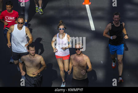 Davenport, Iowa, USA. 13th July, 2017. Liz Nolte of Davenport, center, runs the start of the Bix at Six training run in Davenport on Thursday, July 13, 2017. The run marks the third and final training run leading up to the Quad-City Times Bix 7 Race on Saturday, July 29. Credit: Andy Abeyta, Quad-City Times/Quad-City Times/ZUMA Wire/Alamy Live News Stock Photo
