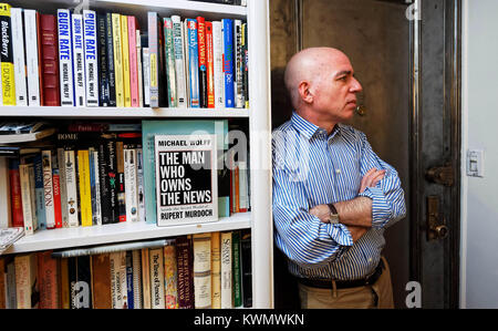 Author Michael Wolffwho's latest book “Fire and Fury: Inside the Trump White House,” has sparked a war of words between the President and former advisor Steve Bannon, is pictured in his Manhattan apartment in 2008. photo by Trevor Collens Stock Photo