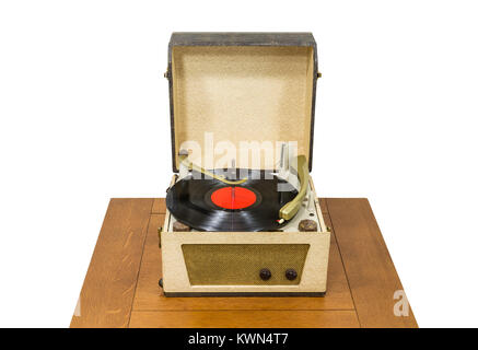 Vintage turntable with red record album isolated on white. Stock Photo