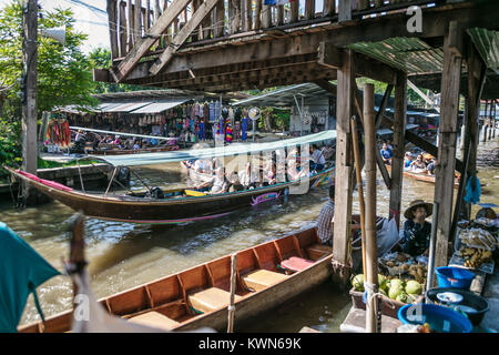Tourists in boat on river Damnoen Saduk Floating Market, Thailand. Stock Photo