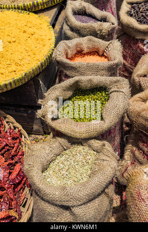 Sack of dried green beans on the wooden table background at market Stock Photo