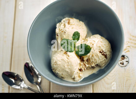 Vanilla ice cream in blue bowl Stock Photo