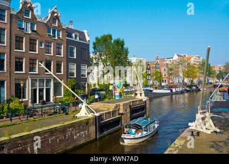 Boat, going through Sint Antoniesluis canal lock, Amsterdam, The Netherlands Stock Photo