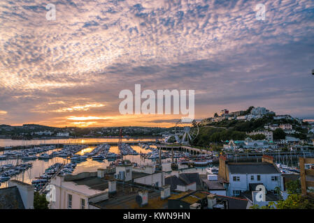 Torquay, Devon, England. August 2017 - Panoramic view of the harbor of the popular seaside resort town during a colorful sunset. Stock Photo