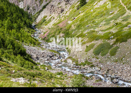 Hiking trail in Aosta Valley, Italy. Detail of the beautiful Grauson walloon and its creek.