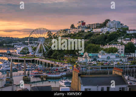 Torquay, Devon, England. August 2017 - Panoramic view of the harbor of the popular seaside resort town during a colorful sunset. Stock Photo