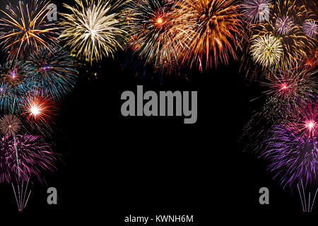isolated new year fireworks on black background with copy space in the middle Stock Photo