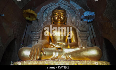 Gawdawpalin Temple, A buddha statue in the corridor of the 11th century Gawdawpalin temple in Old Bagan in Myanmar. Stock Photo