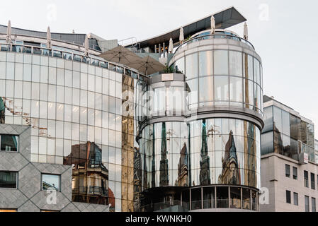 Vienna,  Austria - August 16, 2017: Low angle view of Haas House building in Stephenplatz. Designed by the Austrian architect Hans Hollein, it is a bu Stock Photo