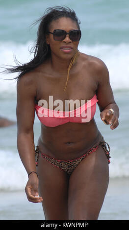 MIAMI BEACH, FL - APRIL 16:  Tennsi great Serena Williams took a break from her rehab efforts with a day at the beach.  The 29-year-old hit Sobe with friends and ate some lunch on the beach before  taking a dip in the ocean wearing a two piece swimsuit with a pink top and leopard print bottom.  on April 16, 2011 in Miami Beach, Florida.   People:  Serena Williams Stock Photo