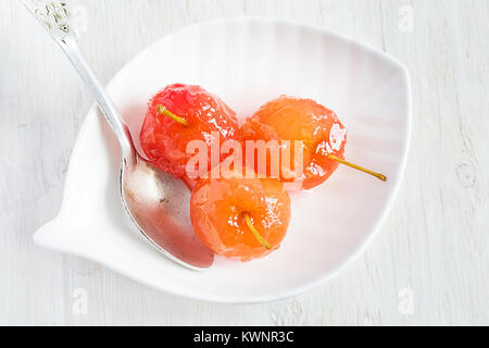 Apple jam with whole apples on a white background Stock Photo