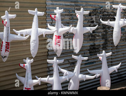 Inflatable airplane toys hanging at outdoor park along coast near Aeroparque Jorge Newbery; Buenos Aires; Argentina Stock Photo