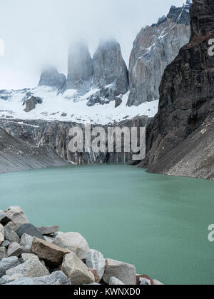 Low clouds in pre-dawn light; famous Torres del Paine; Torres del Paine National Park; Chile Stock Photo