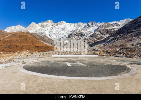 Helipad (helicopter pad) sign and Himalayas on background near the Kedarnath Temple in Uttarakhand state, India. Stock Photo