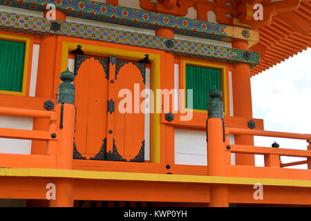 Architectural detail of Sanjunoto pagoda at Kiyomizu-dera Buddhist temple painted in bright orange with colorful ornaments. Kyoto, Japan. Stock Photo