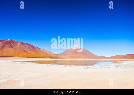 Licancabur volcano and  Green Lake (Laguna Verde) in bolivian Altiplano Stock Photo