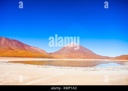 Licancabur volcano and  Green Lake (Laguna Verde) in bolivian Altiplano Stock Photo