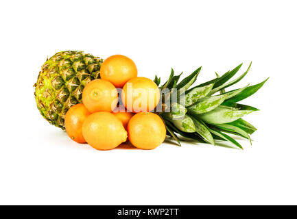 On a white background there is a large ripe pineapple and a number of mandarins Stock Photo