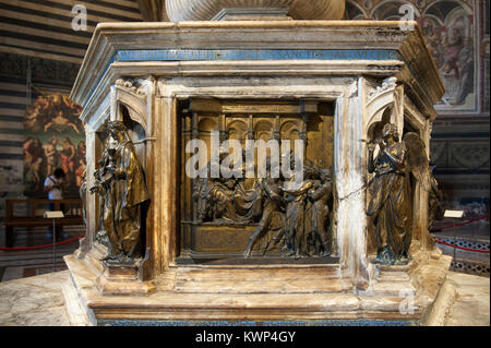 Gothic Battistero di San Giovanni (Baptistry of St. John) of Cattedrale Metropolitana di Santa Maria Assunta (Siena Cathedral of Assumption of Mary) i Stock Photo