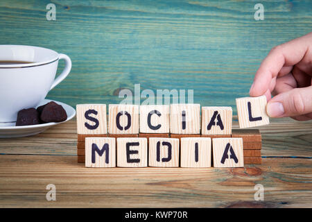 social media. Wooden letters on the office desk, informative and communication background Stock Photo