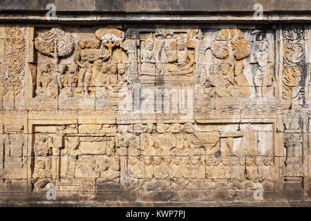 Relief panel in Borobudur Temple in Magelang, Central Java in Indonesia Stock Photo