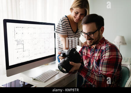 Young attractive designers working together from home Stock Photo