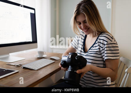 Portrait of young woman designing at home Stock Photo