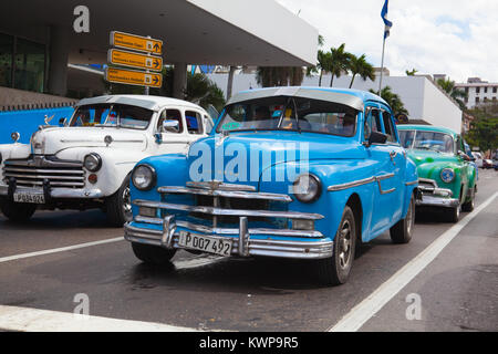 Havana, Cuba - January 21,2017: Old american cars on the road Old Havana, Cuba.Thousands of these cars are still in use in Cuba and they have become a Stock Photo