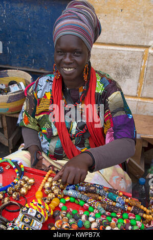 Woman selling souvenirs in the streets of Saint Louis, northern Senegal Stock Photo