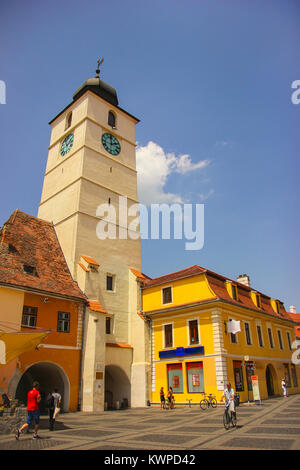 Sfatului Tower in Sibiu, Romania with medieval buildings and blue sky background Stock Photo
