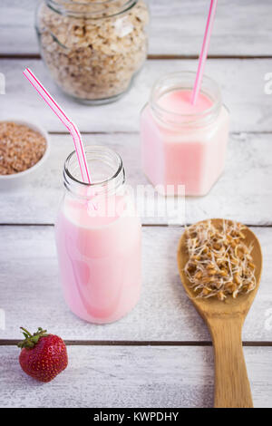 Concept of healthy food: yogurt and wheat germ on a wooden table Stock Photo