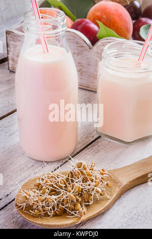 Concept of healthy food: yogurt and wheat germ on a wooden table Stock Photo