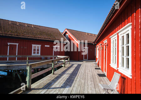 Henningsvaer, Norway - August 19,2017: Picturesque fishing port in Henningsvaer on Lofoten islands, Norway with typical red wooden buildings and small Stock Photo