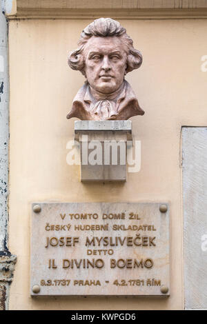 PRAGUE, CZECH REPUBLIC - DECEMBER 23RD 2017: A sculpture and plaque marking the location where Czech composer Josef Myslivecek lived in Prague - image Stock Photo