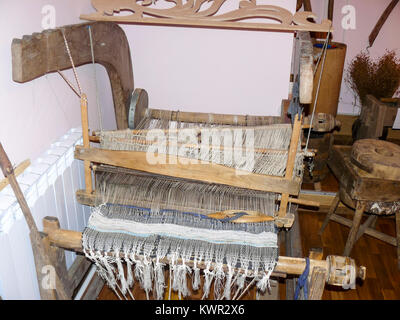 Ancient wooden loom. Ancient textile equipment. Stock Photo