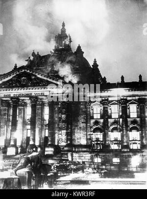 Photograph of the Reichstag fire in Berlin on February 27, 1933, showing the burning parliamentary building and its historical significance in Nazi Germany. Stock Photo