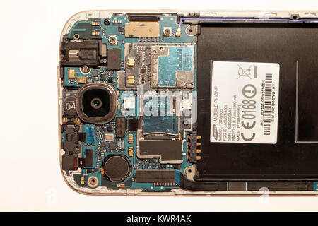 Inside view of samsung galaxy 4 smartphone Electronic components circuit board technology Stock Photo