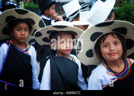 Galapagos Islands children in traditional costume taking part in a street carnival, Puerto Ayora, Santa Cruz island, Galapagos, Ecuador South America Stock Photo