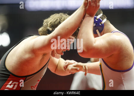 Des Moines, Iowa, USA. 16th Feb, 2017. North Scott's Cole Ernst grapples with Johnston's Jake Ryan during session one of the 2017 IHSAA State Wrestling Championships at Wells Fargo Arena in Des Moines on Thursday, February 16, 2017. Credit: Andy Abeyta/Quad-City Times/ZUMA Wire/Alamy Live News Stock Photo